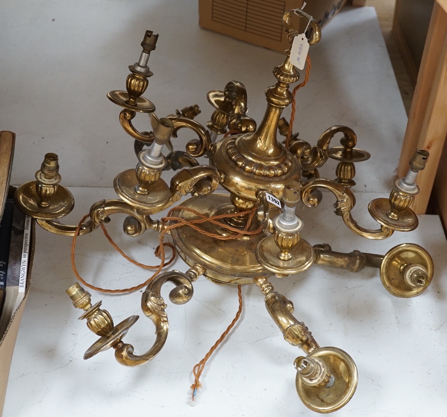 A brass two tier twelve light chandelier, 61cms high